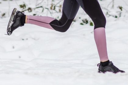 Woman running in the snow