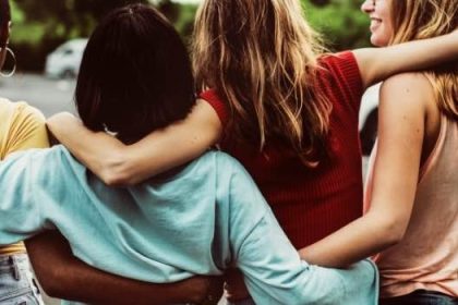 Group of women holding each other