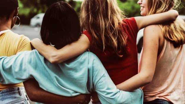 Group of women holding each other